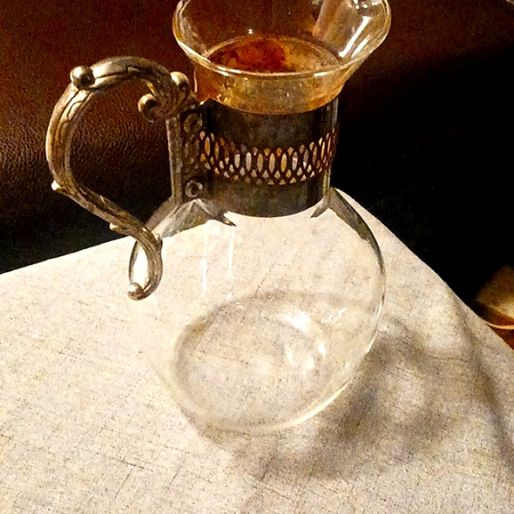 Glass pitcher with silver plated handle -